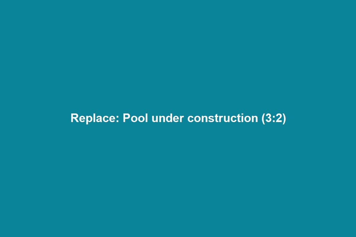 In-ground pool under construction with steel rebar and gunite preparation